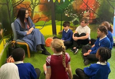 Nesil Caliskan speaking to children at Richard Alibon Primary School.